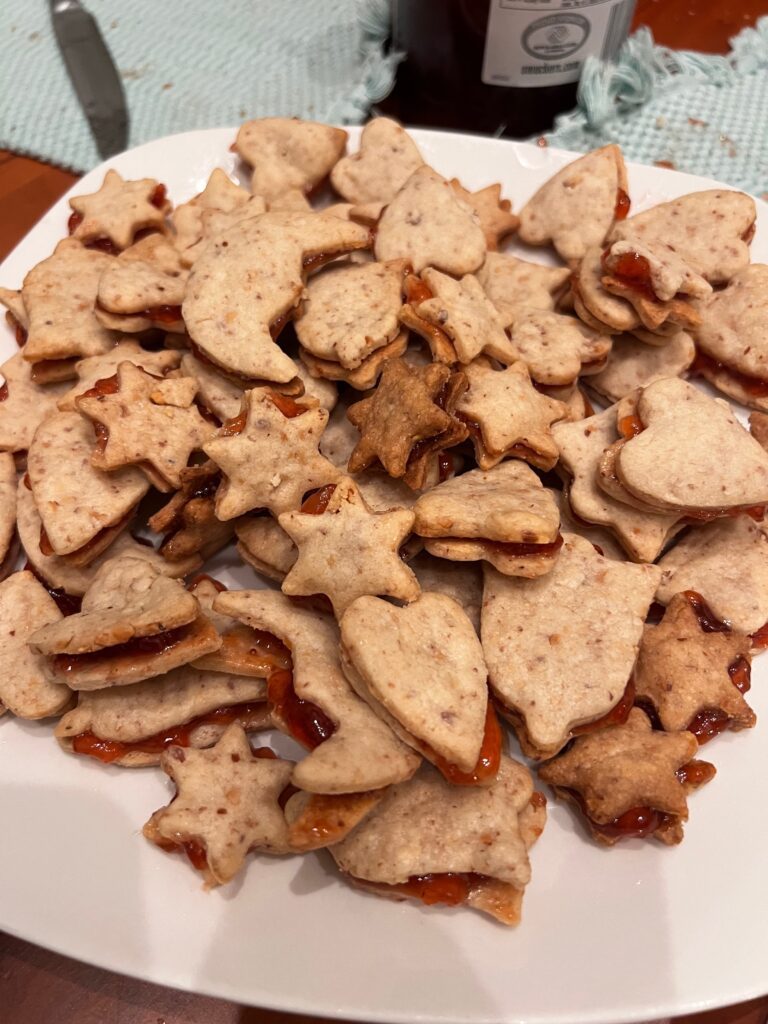 A plate of dozens of freshly-baked holiday cookies.